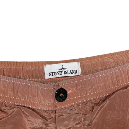 Stone Island orange swim shorts with logo patch and nylon metal material.