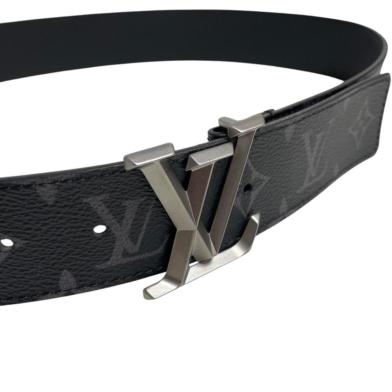 Louis Vuitton black canvas belt with LV monogram pattern and gold-tone buckle.