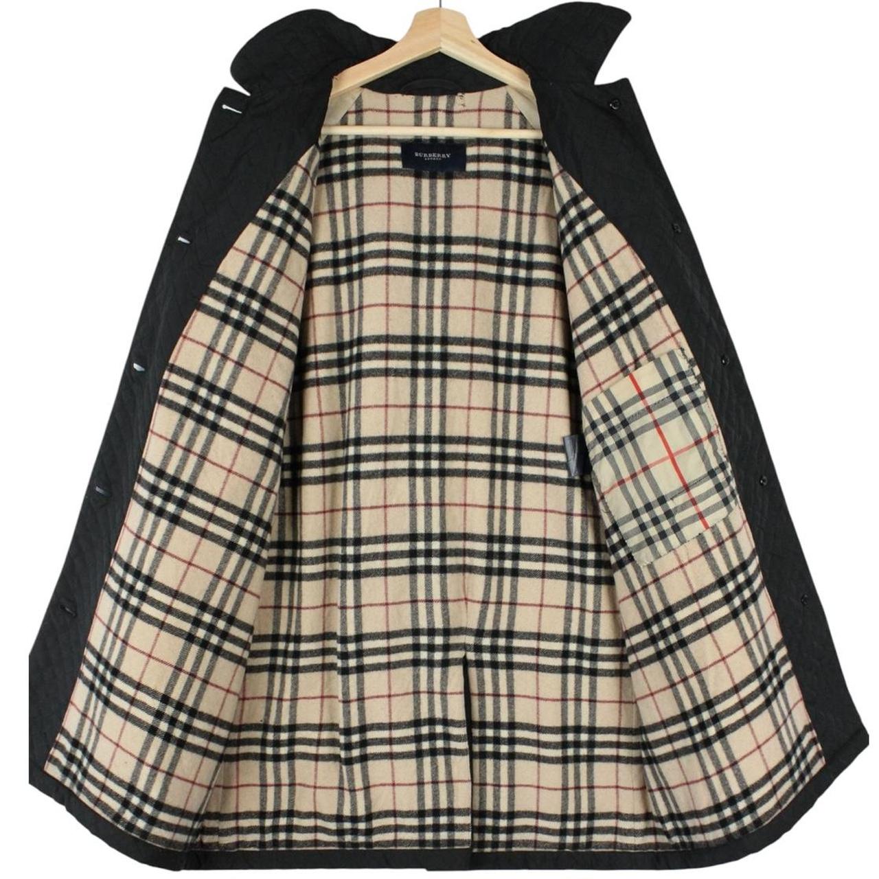 Burberry black quilted jacket with Nova Check lining and logo detail.