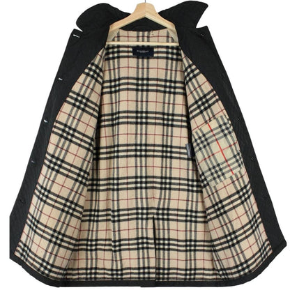 Burberry black quilted jacket with Nova Check lining and logo detail.