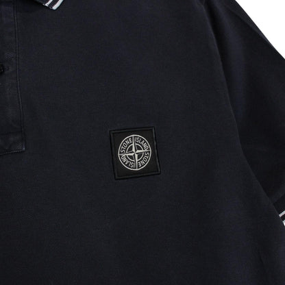 Stone Island navy blue short sleeve polo shirt with compass logo and cotton material.