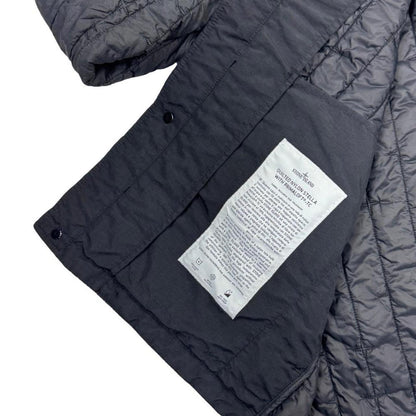 Stone Island black quilted nylon jacket with logo badge and Primaloft-TC material.