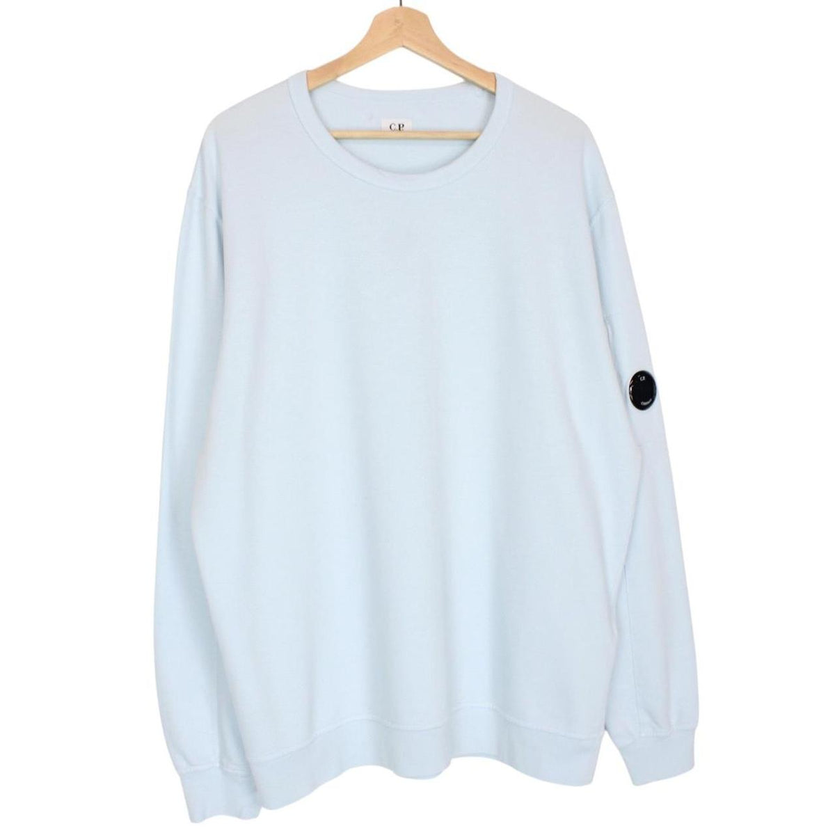 CP Company light blue sweatshirt with signature lens detail and cotton fabric.