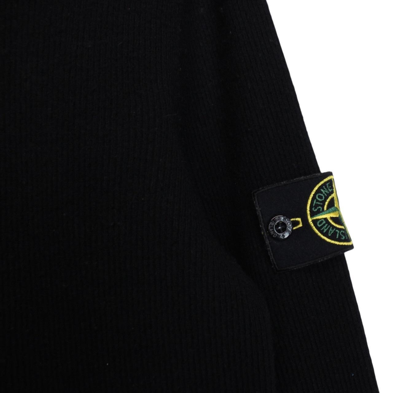 Stone Island black wool knit jumper with iconic compass logo and vintage design.