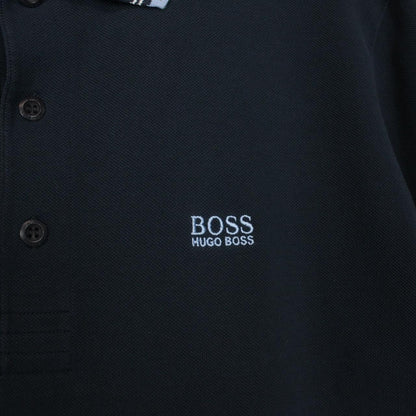 Hugo Boss navy blue short sleeve polo shirt with embroidered logo and cotton material.
