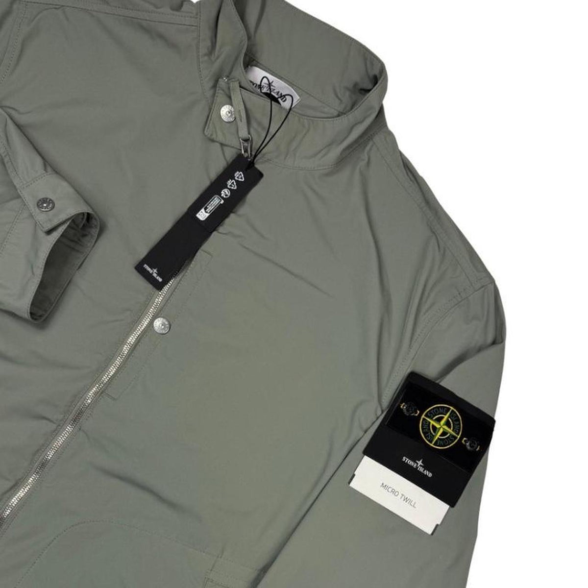 Stone Island green full zip jacket with logo patch and micro twill fabric.