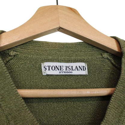 Stone Island green v-neck cotton knit jumper with logo patch and visible wear.