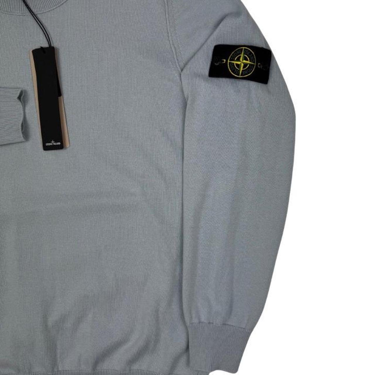 Stone Island grey knit jumper made from organic cotton with logo patch on sleeve.