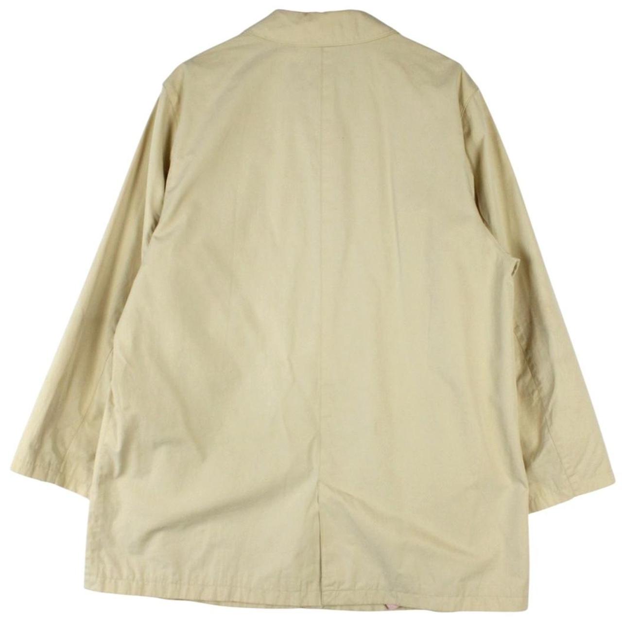 Burberry beige single breasted coat with logo detail and classic tailored design.