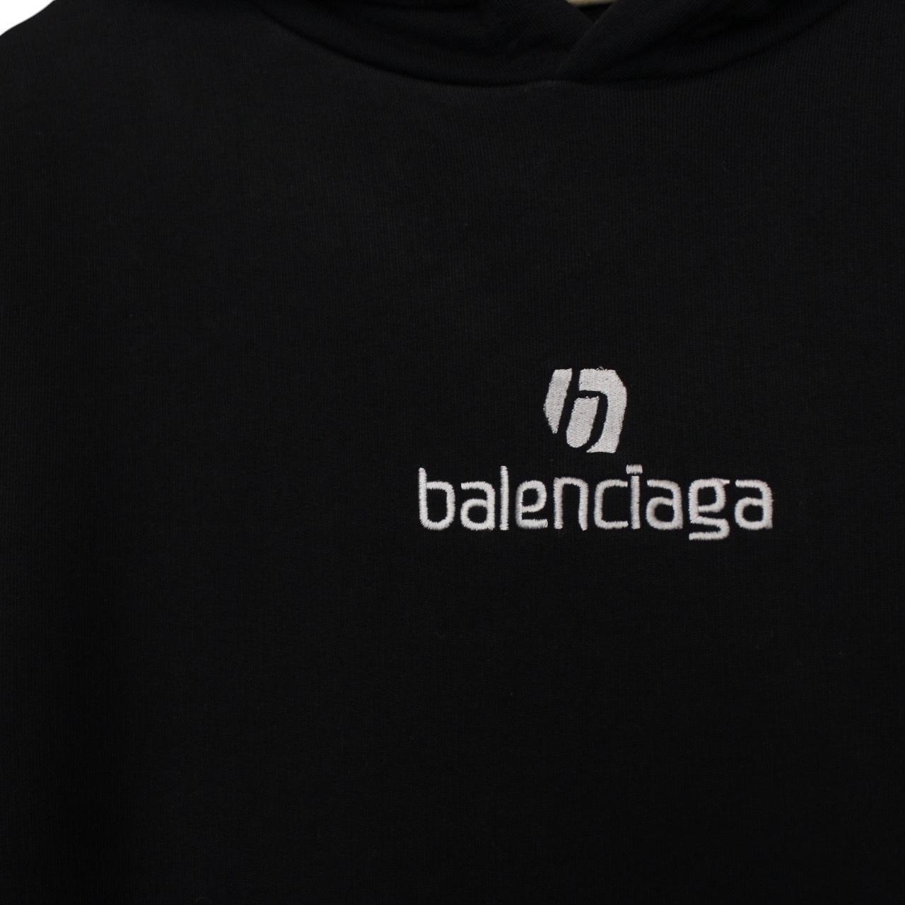 Balenciaga black and white cotton hoodie with sponsor logo and large fit.