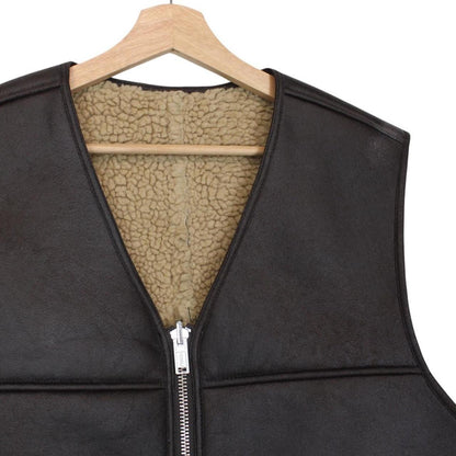 Supreme brown reversible faux shearling work vest with logo patch and textured fabric.