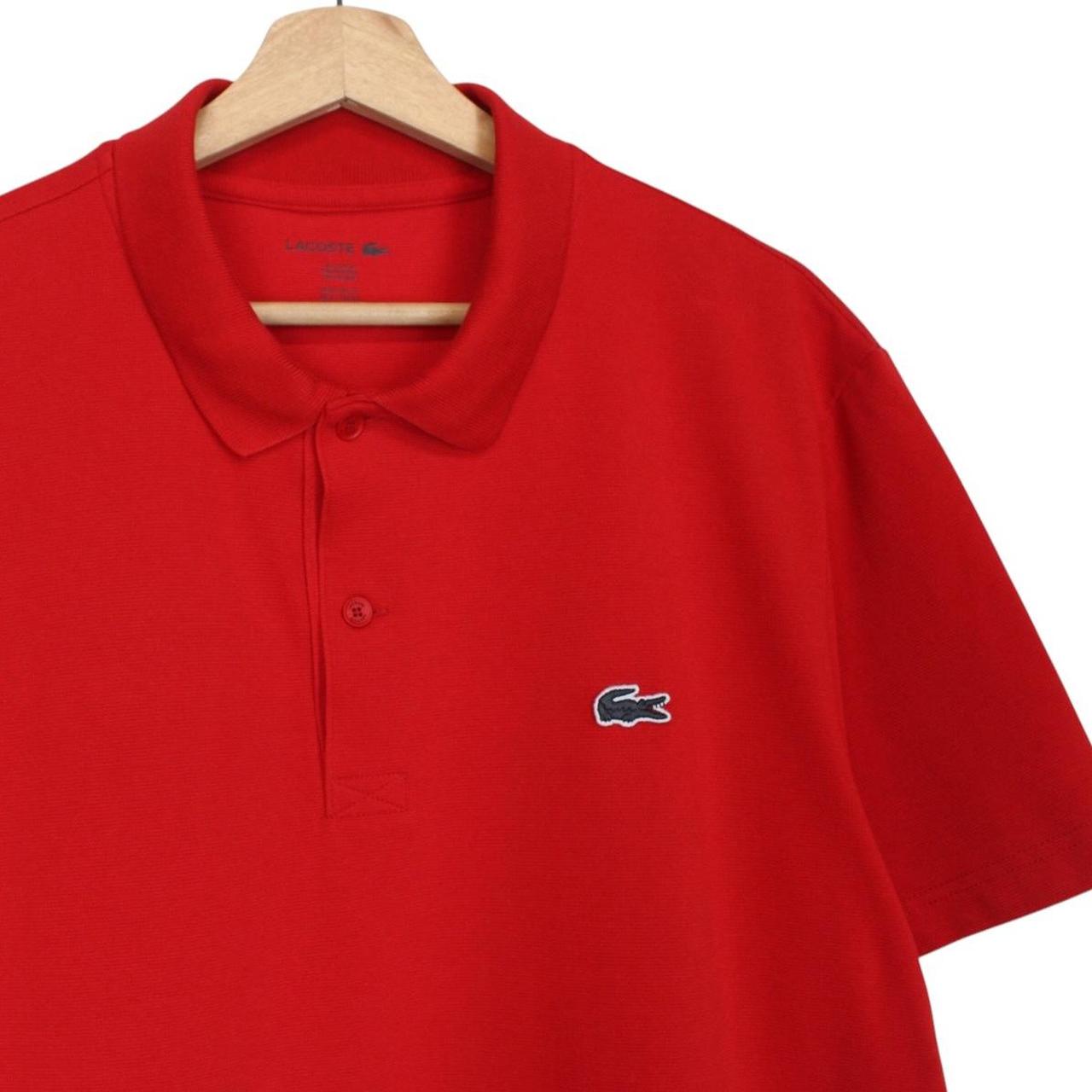 Lacoste red short sleeve polo shirt with embroidered crocodile logo, cotton material.