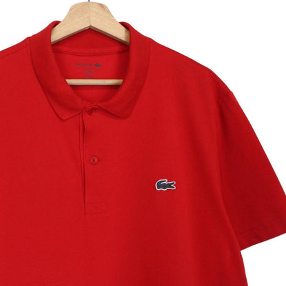 Lacoste red short sleeve polo shirt with embroidered crocodile logo, cotton material.