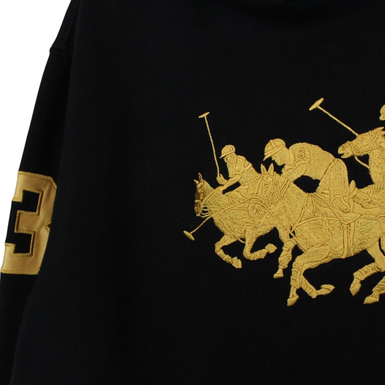 Polo Ralph Lauren black hoodie with gold embroidered Polo Match logo and drawstring.