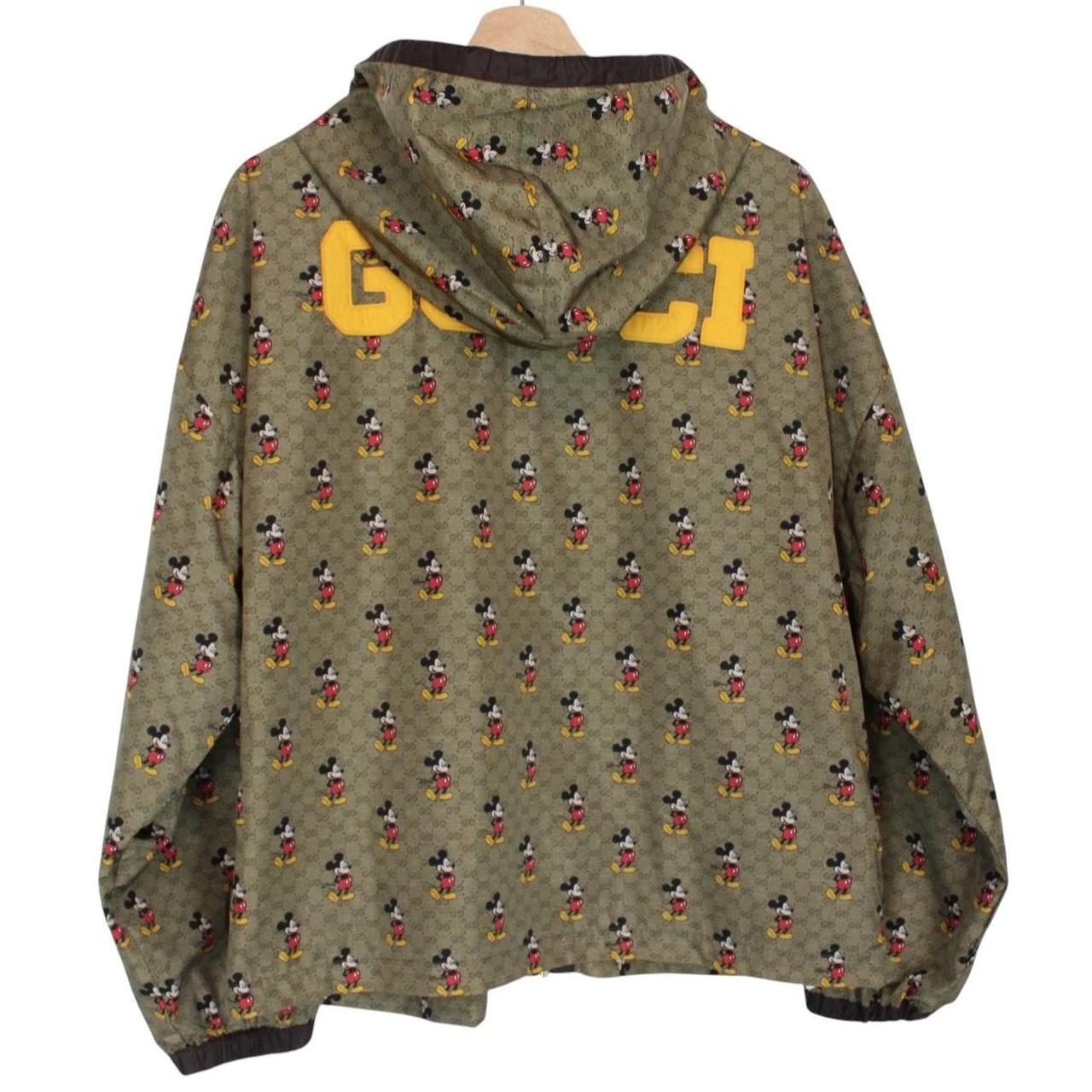 Gucci x Disney khaki brown windbreaker jacket with monogram pattern and nylon material.