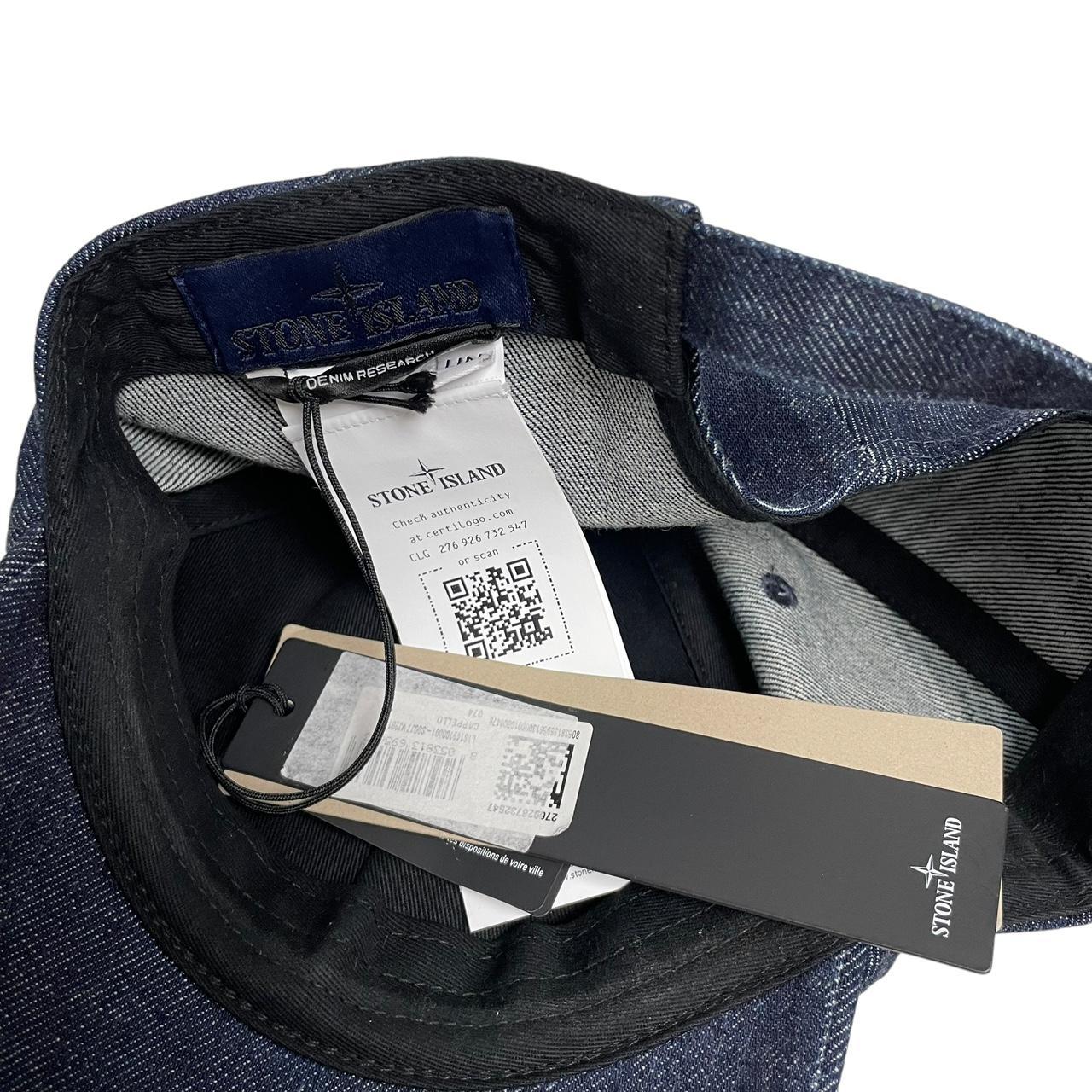 Stone Island blue denim baseball cap with diagonal twill texture and logo patch.