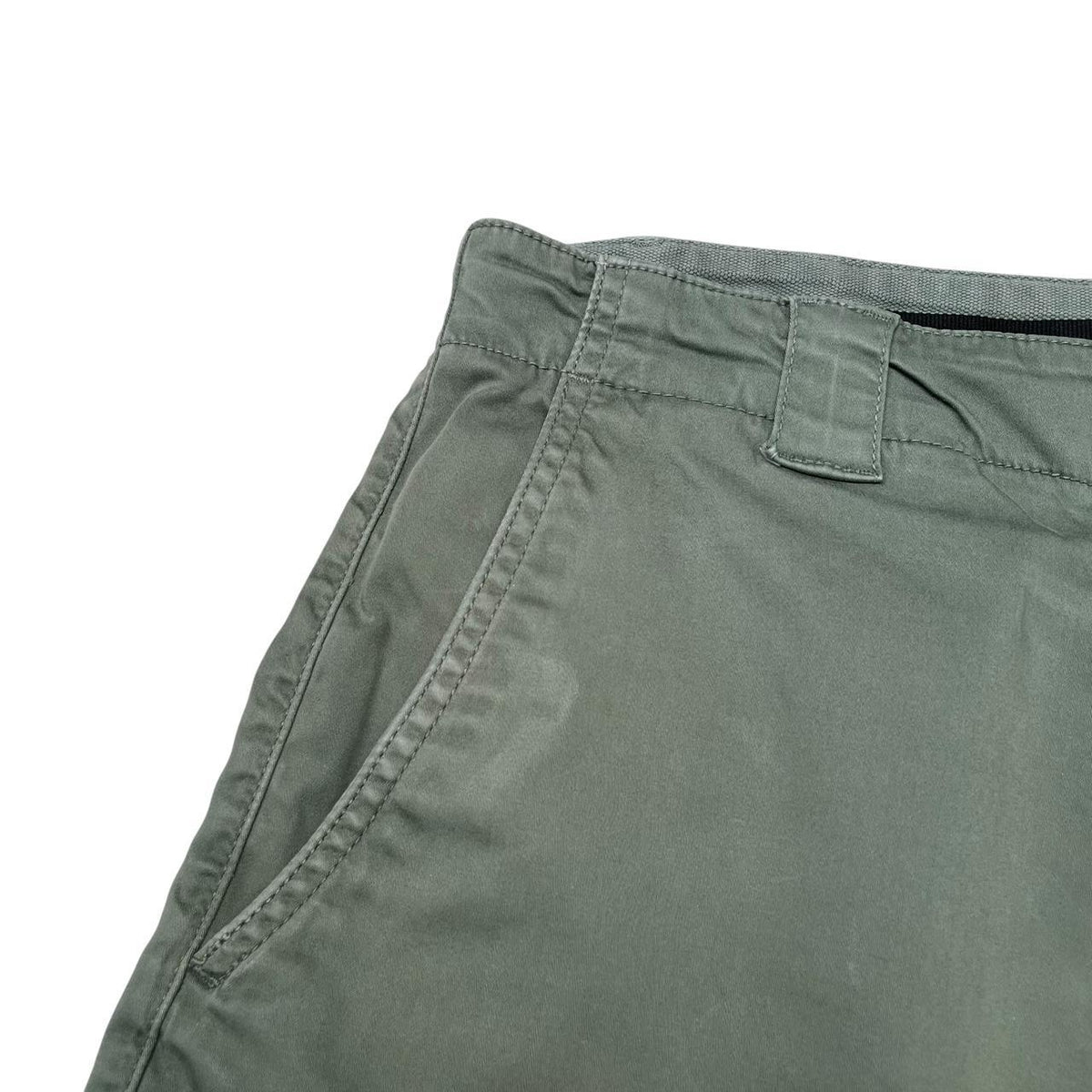 CP Company green cargo shorts with lens detail and cotton material, size XL.