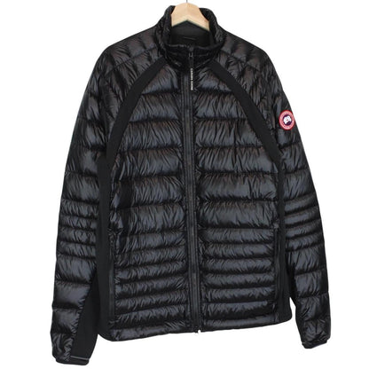 Canada Goose black down jacket with full zip and logo patch on sleeve.