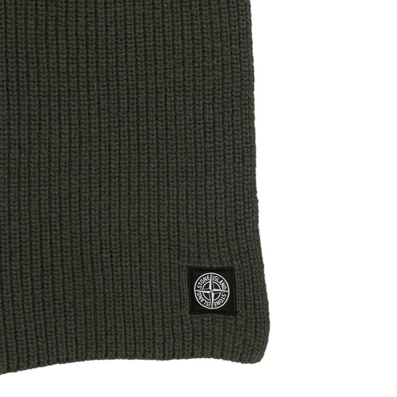 Stone Island green wool scarf with ribbed texture and embroidered logo patch.