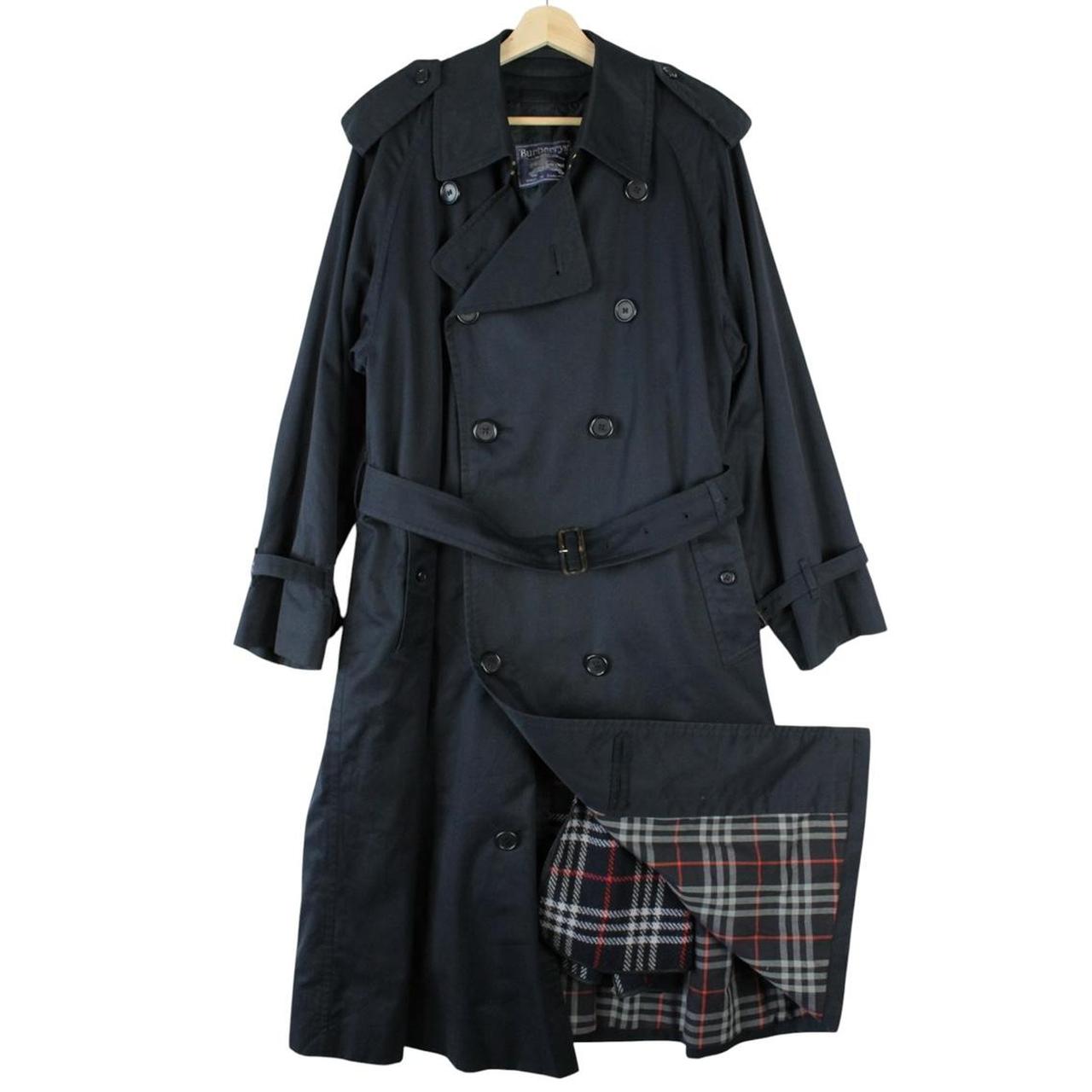Burberry navy blue belted double breasted trench coat with iconic check lining.