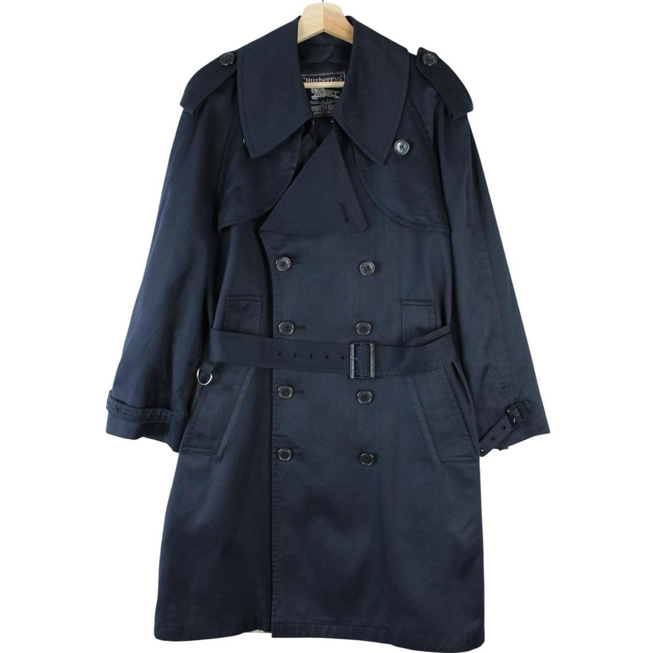 Burberry navy blue double breasted trench coat with belted waist and classic check lining.