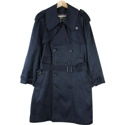 Burberry navy blue double breasted trench coat with belted waist and classic check lining.