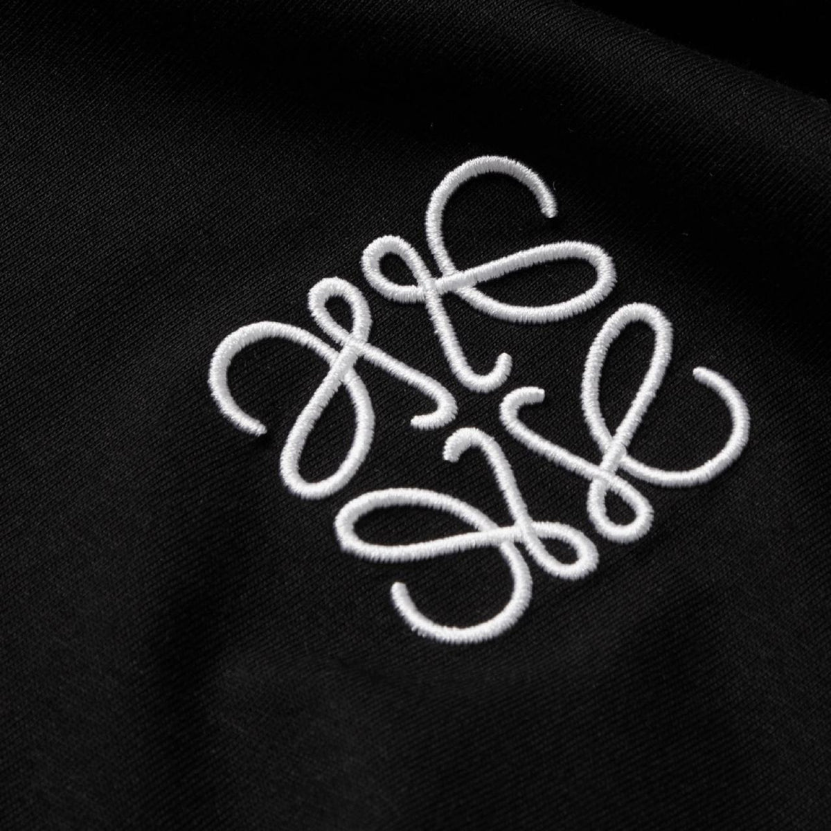Loewe black t-shirt with embroidered anagram logo, made from soft cotton.