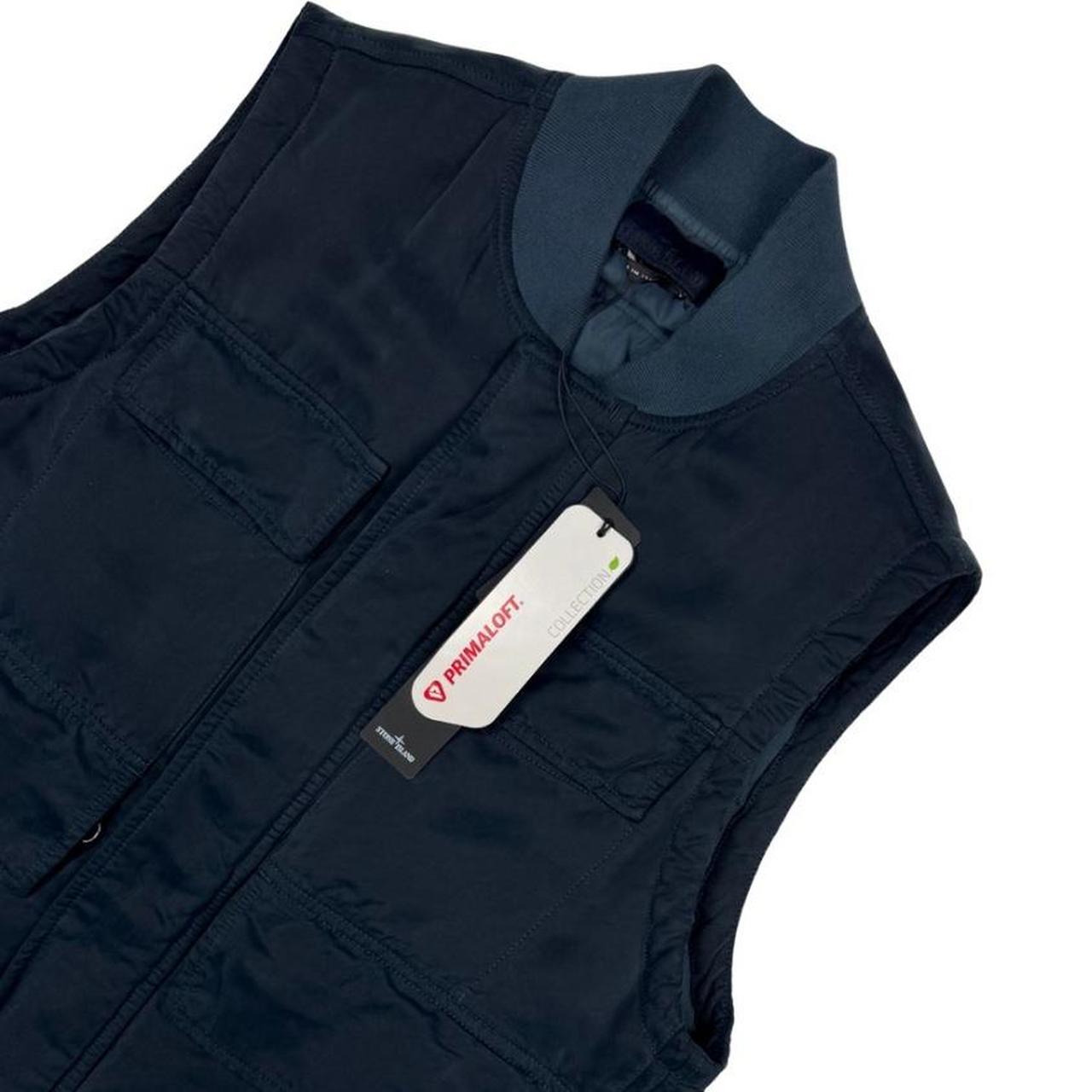 Stone Island navy blue vest jacket with logo patch and Primaloft material.