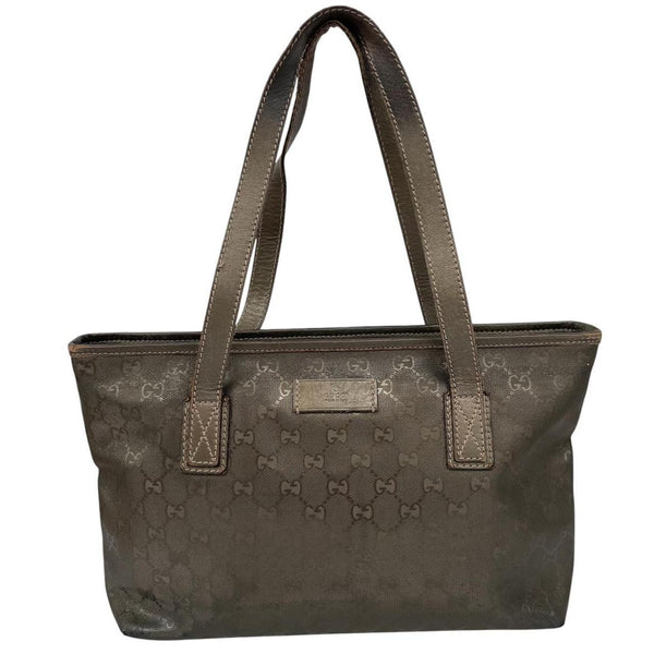 Gucci khaki green duffel bag with metallic monogram canvas and leather trim details.