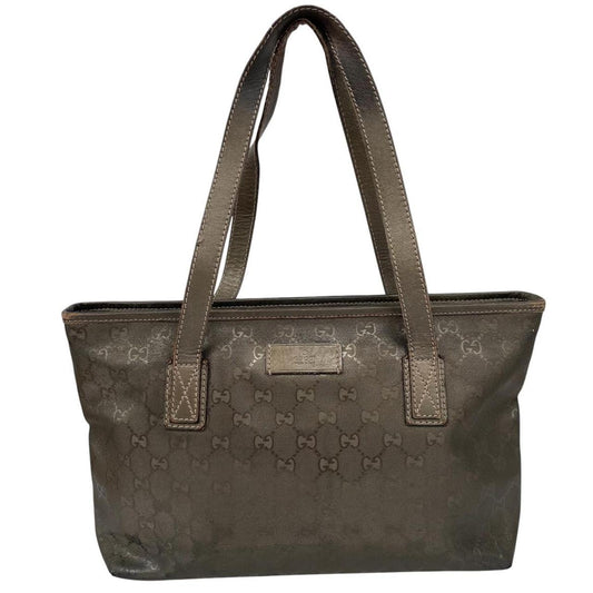 Gucci khaki green duffel bag with metallic monogram canvas and leather trim details.