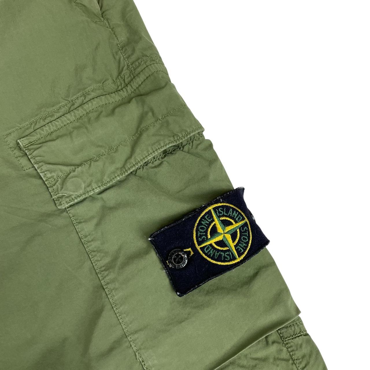 Stone Island green cargo trousers with logo patch and multiple pockets.