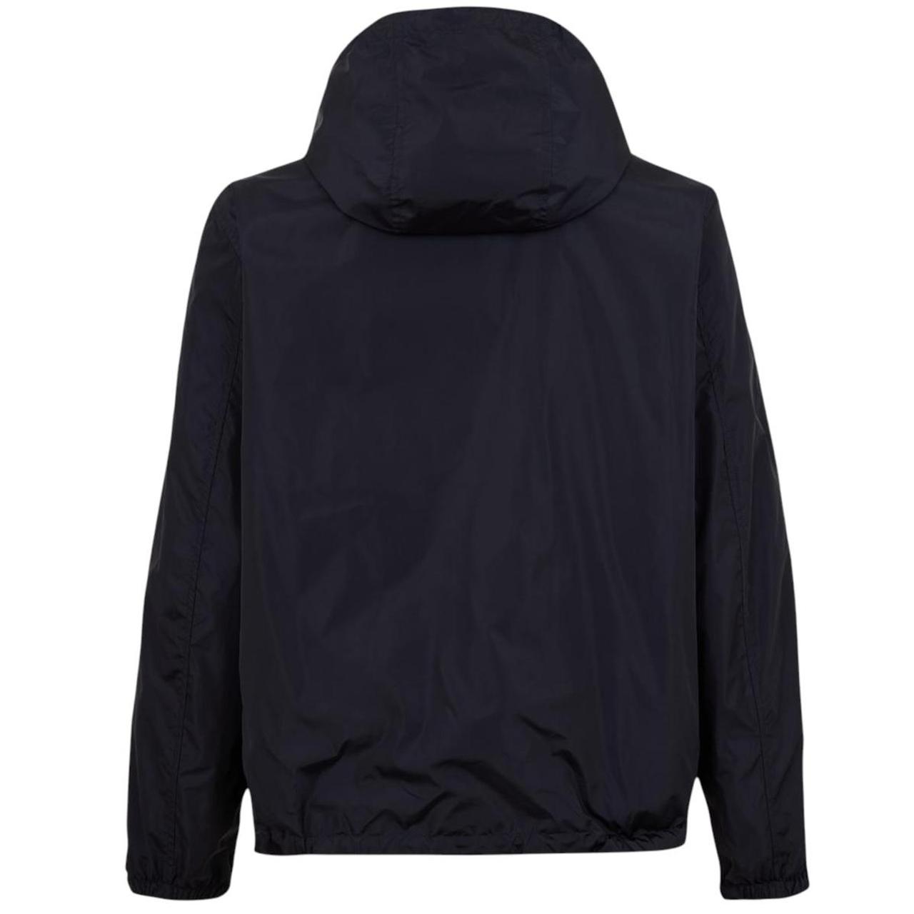Burberry reversible windbreaker jacket in blue and black with Nova Check pattern.