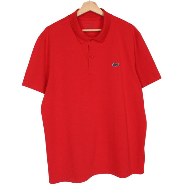 Lacoste red short sleeve polo shirt with embroidered crocodile logo, cotton material.