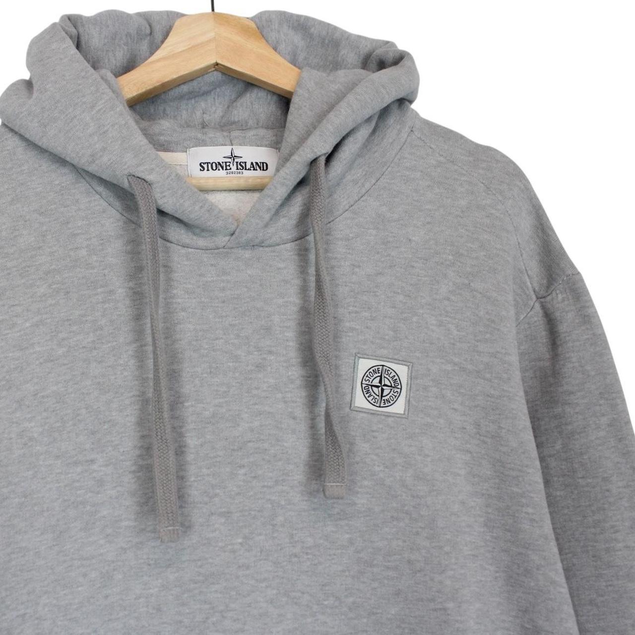 Stone Island grey cotton hoodie with logo patch and slight discolouration on sleeve.
