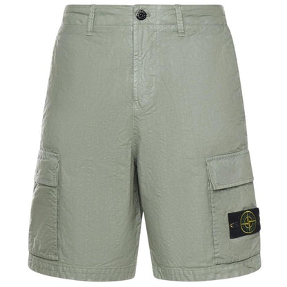 Stone Island green cargo shorts with multiple pockets and "OLD" effect garment-dye treatment.