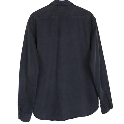 CP Company navy blue overshirt jacket with diamond pattern and lens detail.