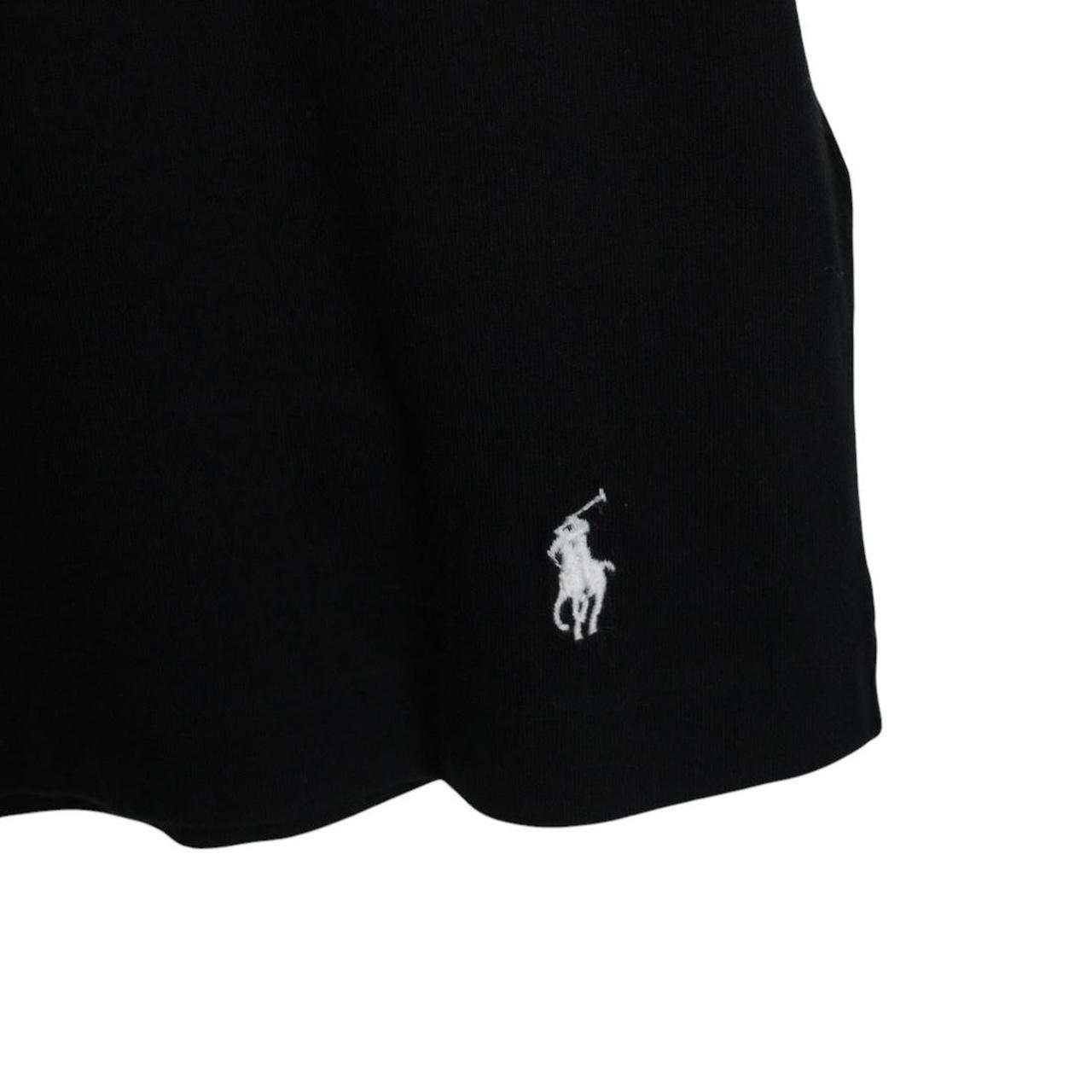 Polo Ralph Lauren black and white pocket t-shirt with logo print and cotton material.