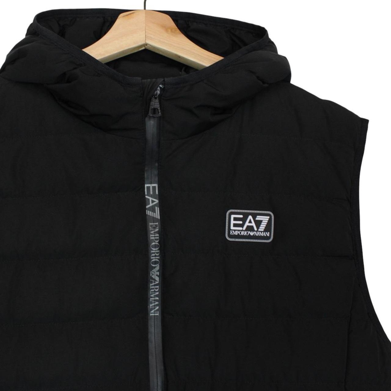 Emporio Armani black quilted hooded gilet with logo detail and zip pockets.