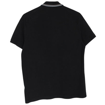 Stone Island black polo shirt with embroidered compass logo and cotton material.