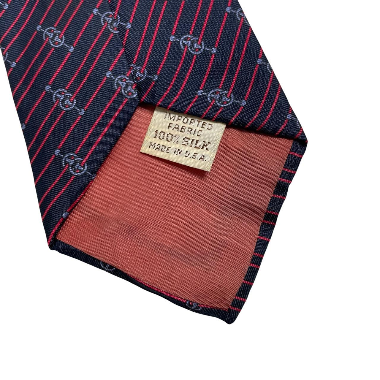 Yves Saint Laurent navy blue and red striped silk tie with logo detail.