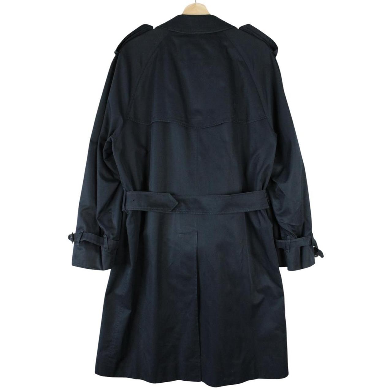 Burberry navy blue trench coat with belted waist and single breasted design.