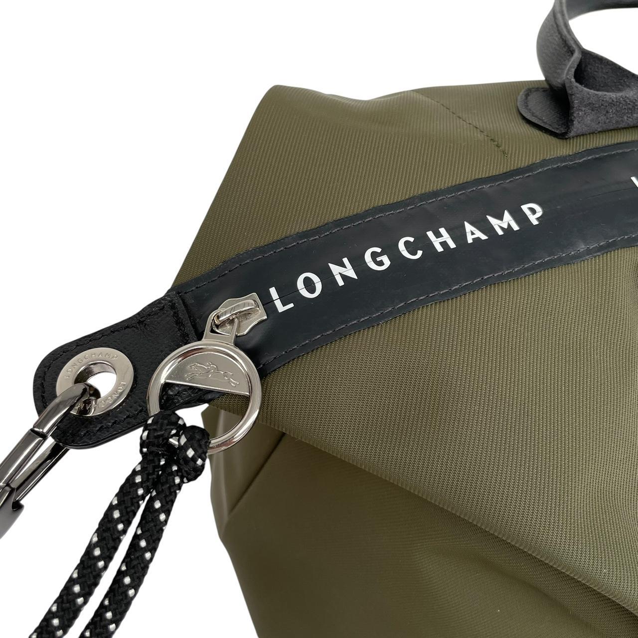 Longchamp green Le Pliage Enery tote bag with logo and durable nylon material.