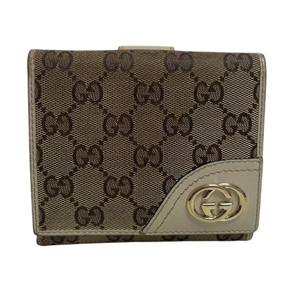 Gucci brown bifold wallet with Supreme monogram pattern and leather accents.