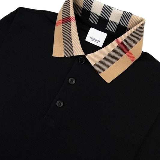 Burberry beige polo shirt with black Nova Check collar and cotton material.