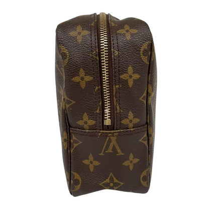Louis Vuitton brown and tan monogram toiletry pouch with iconic logo and canvas material.