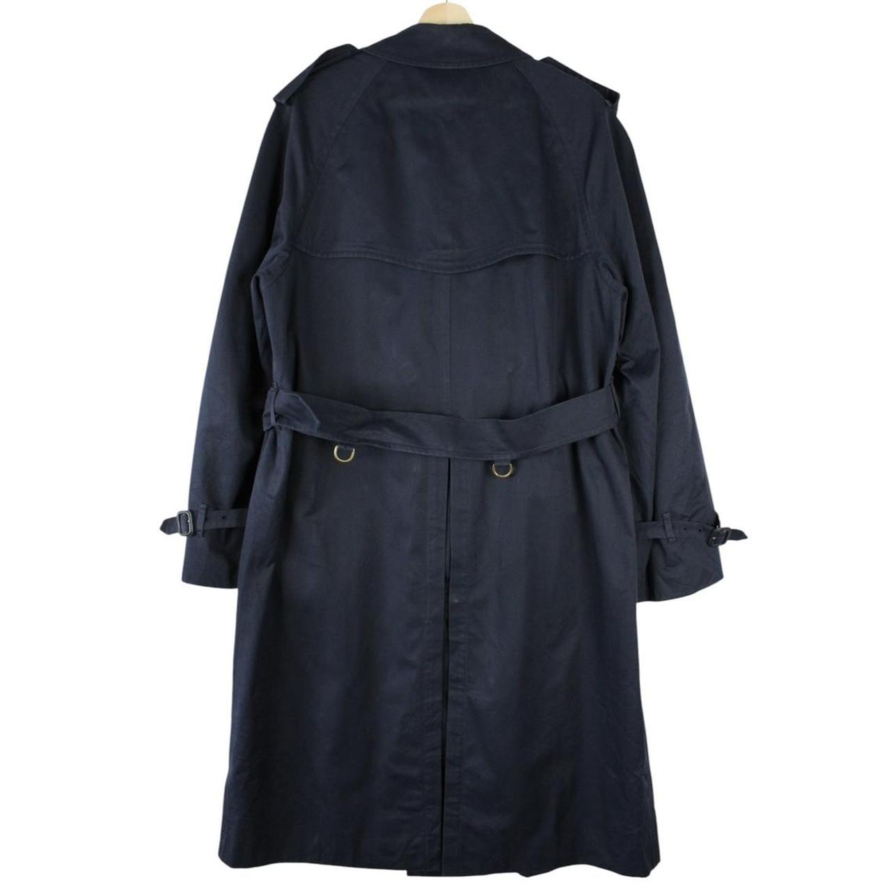 Burberry navy blue belted double breasted trench coat with classic check lining.