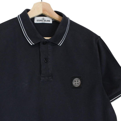 Stone Island navy blue short sleeve polo shirt with compass logo and cotton material.