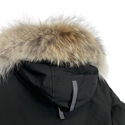 Canada Goose black parka with fur trim, logo patch, and down insulation.
