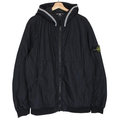 Stone Island black jacket with crinkle texture and logo patch on sleeve.