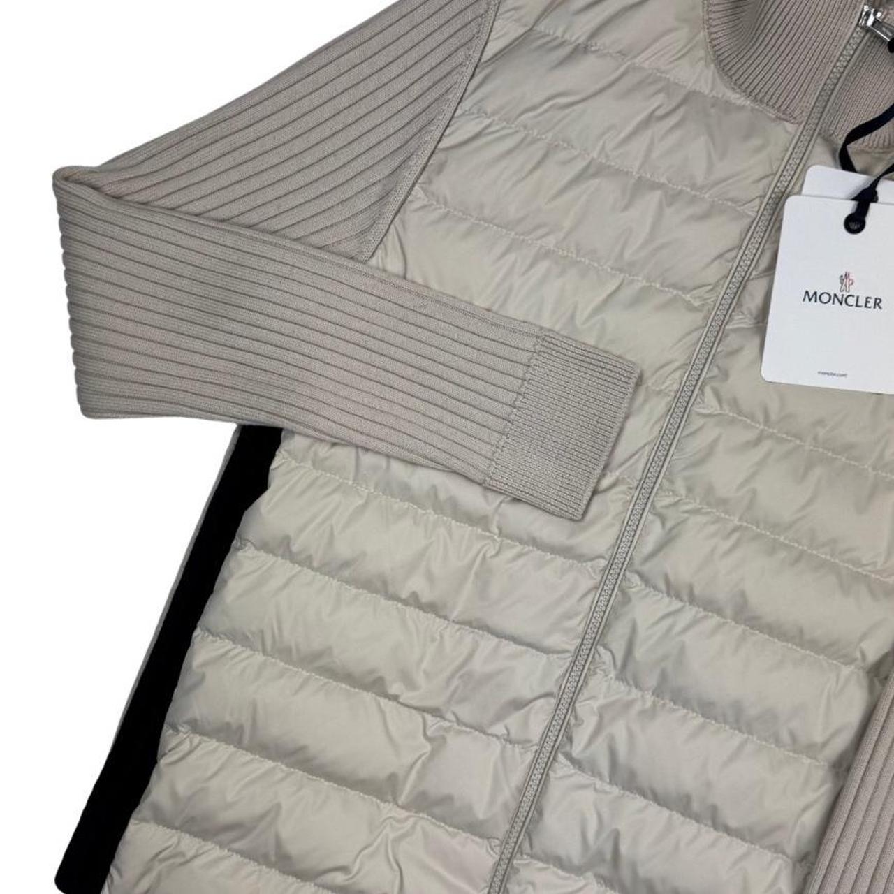 Moncler beige full zip jacket with logo detail and nylon/wool blend material.